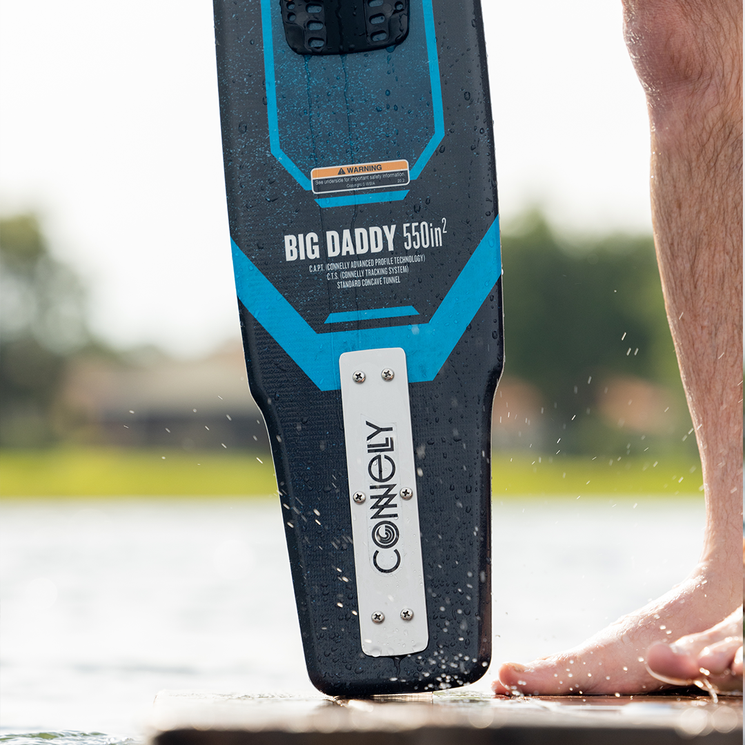 Close-up of the Connelly Big Daddy ski tail resting on a dock, featuring branding and design details.