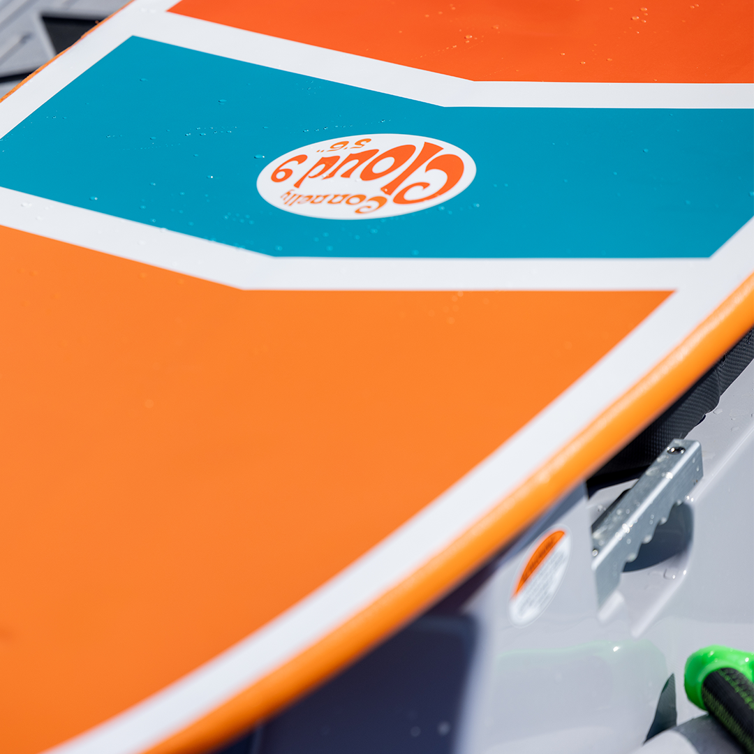 Close-up of the Cloud 9 wakesurfer logo on the back, featuring orange, white, and blue chevron graphics.