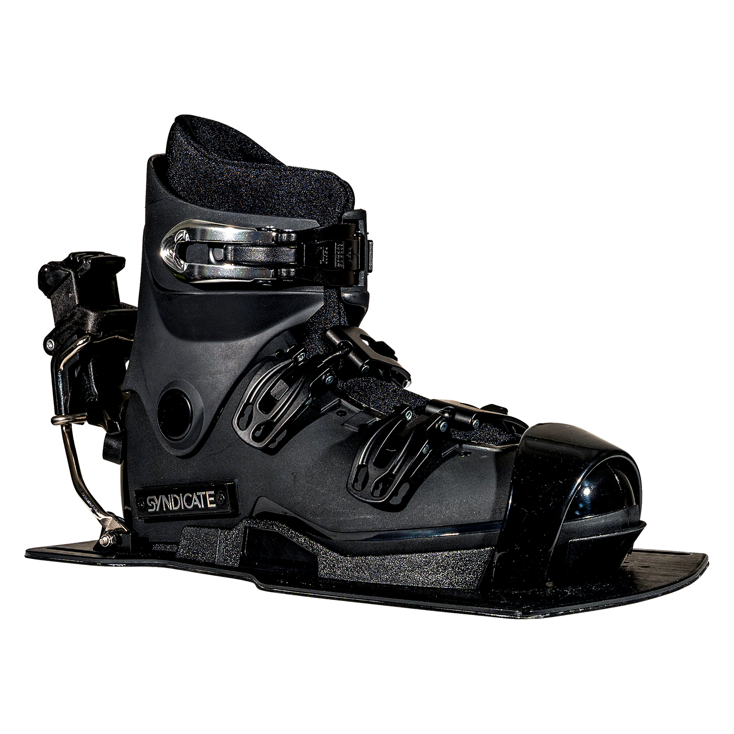 Angled front view of the Syndicate Hardshell boot, showing black construction, adjustable straps, and a metal heel release.