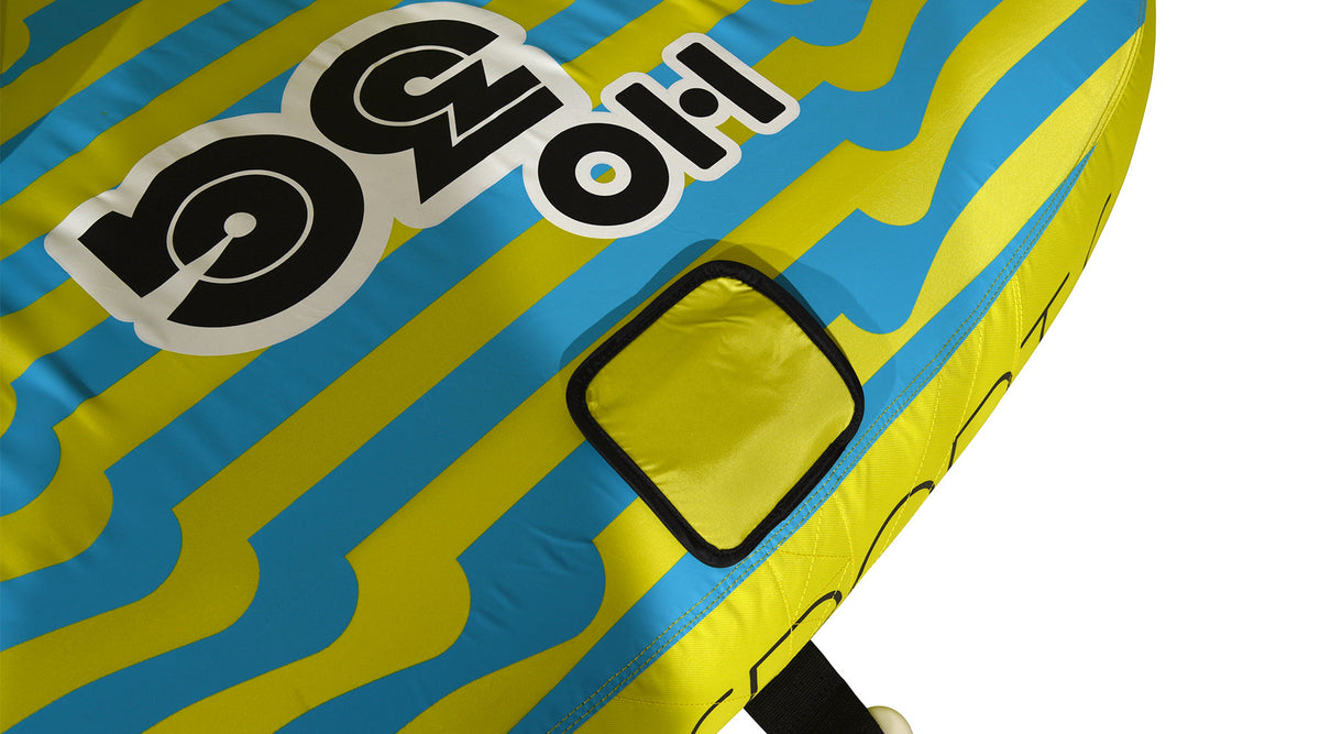 Close-up view of 3G Tube yellow square patch on striped blue and yellow fabric.