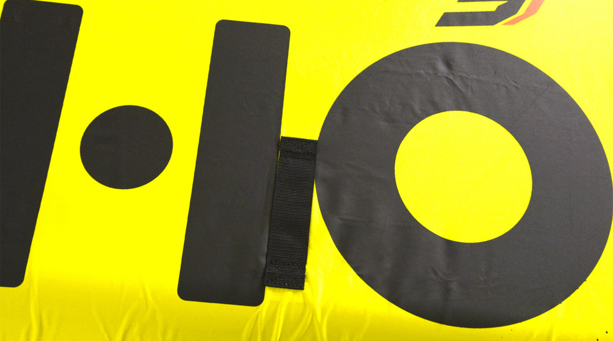 Close-up view of Glide 3 Tube large black logo on bright yellow surface.