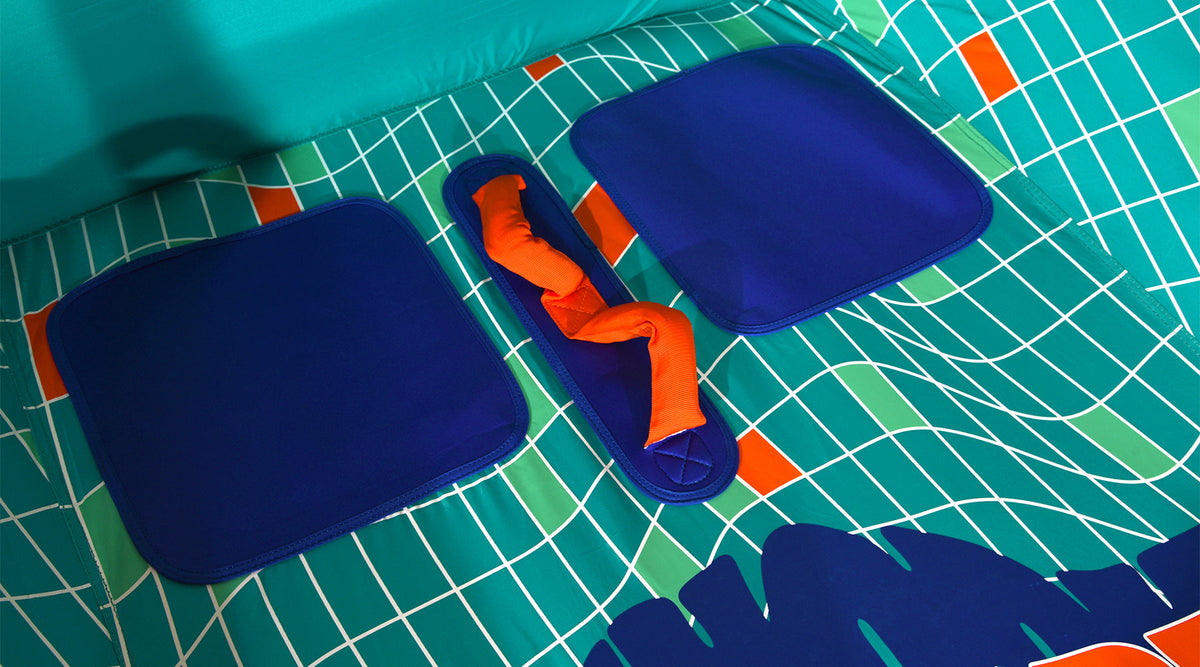 Detail view of Laguna 2 Tube interior with blue seat pads and orange handle.