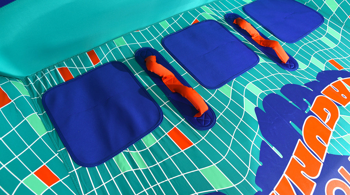 Detail view of Laguna 3 Tube interior with blue seat pads and orange grab handles.