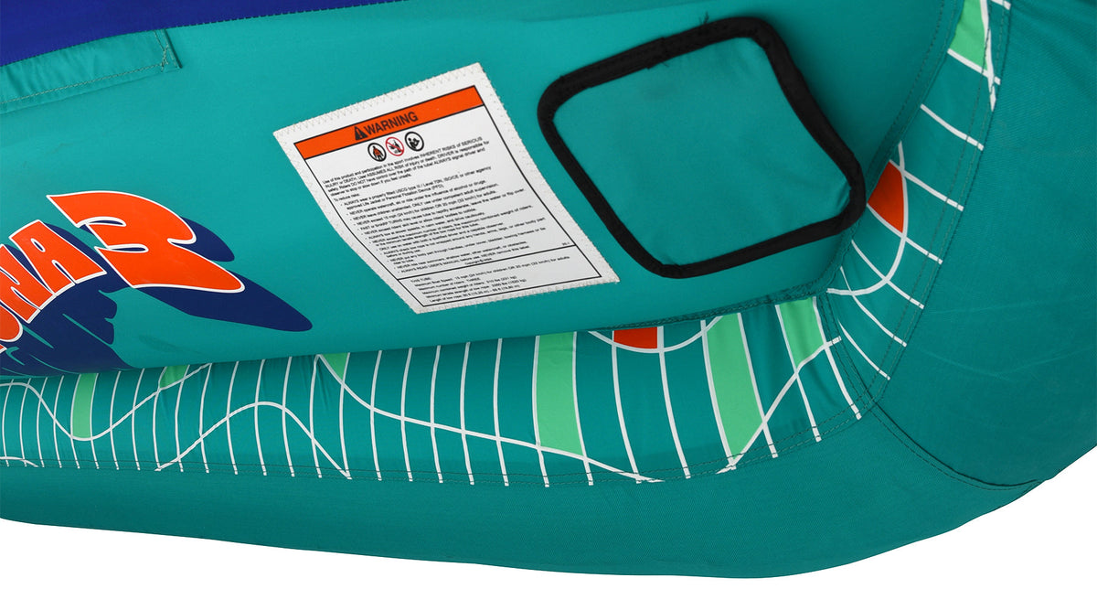 Close-up bottom view of Laguna 3 Tube with warning label and teal patch.