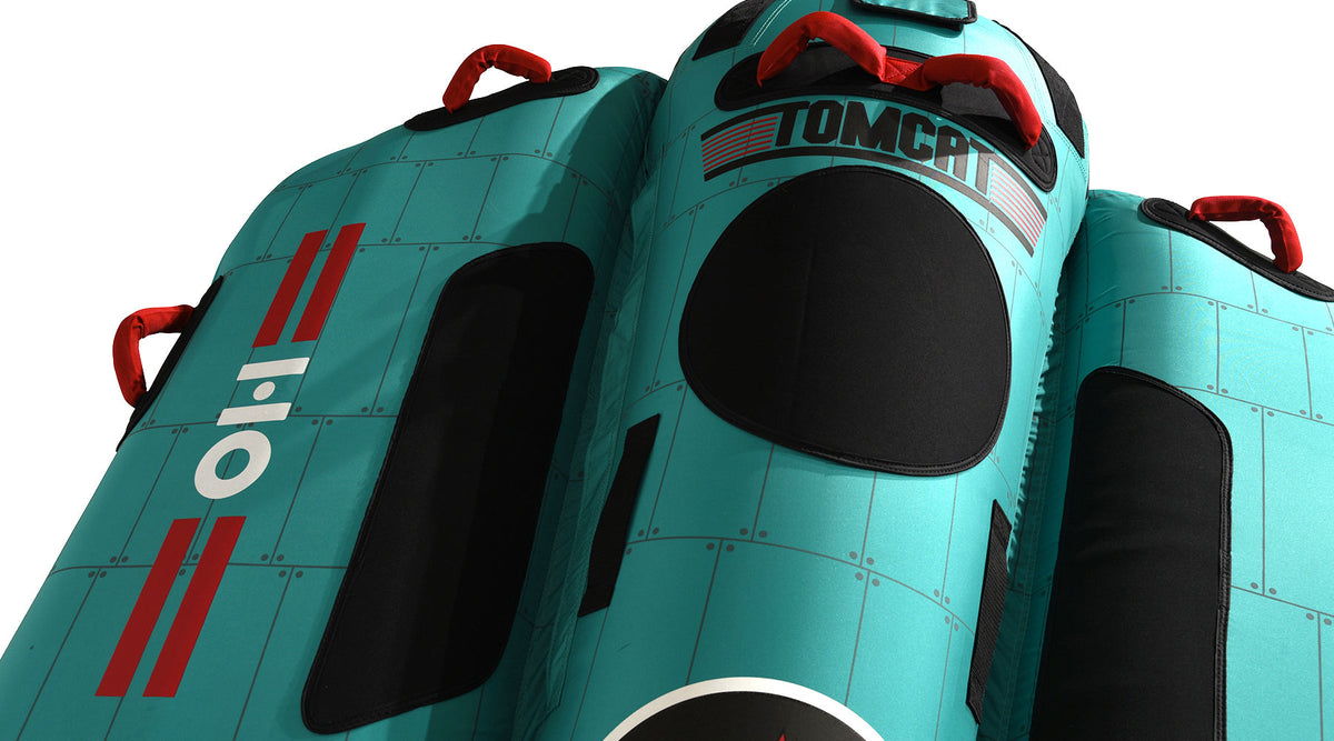 Angled top view of Tomcat Tube showing TOMCAT lettering and red grab handles.