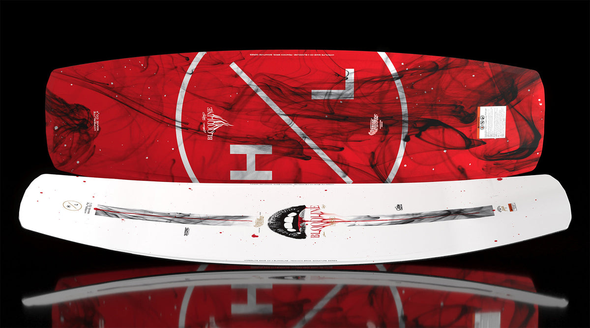 Angled view showing red base and white top of Bloodline wakeboard with smoke graphics.