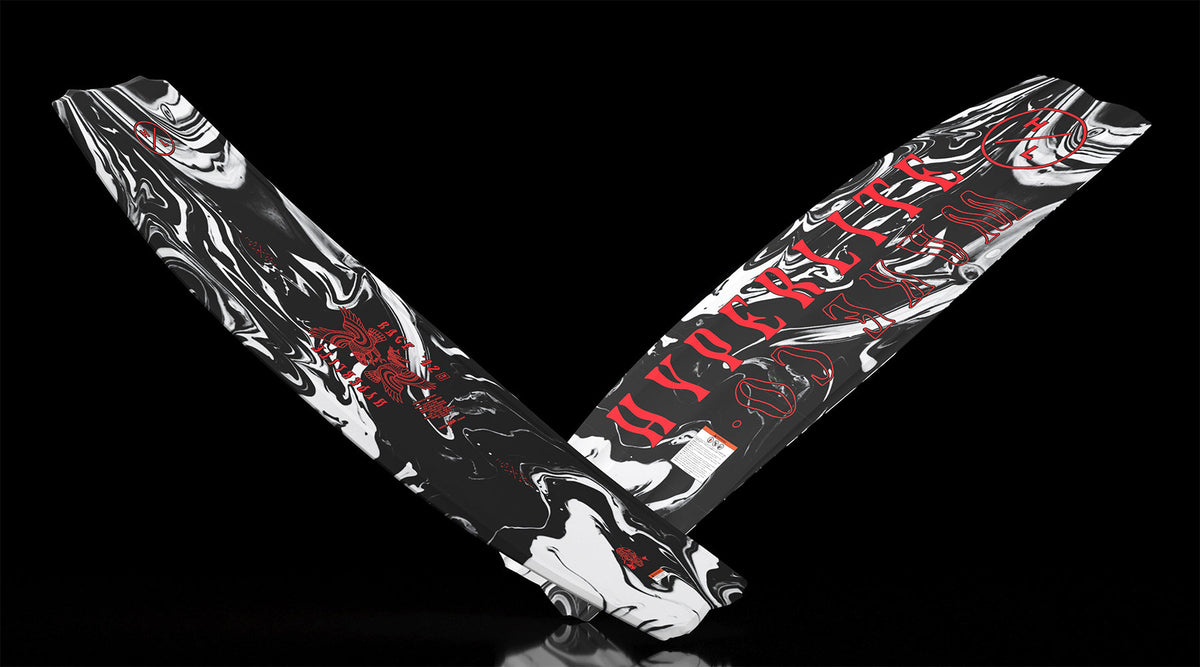 Angled view showing Rage wakeboard base and top with bold marble pattern and red graphics.