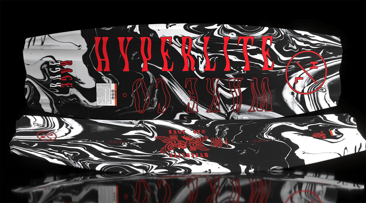 Rage wakeboard bottom with red text and HL circle logo on black and white marble.