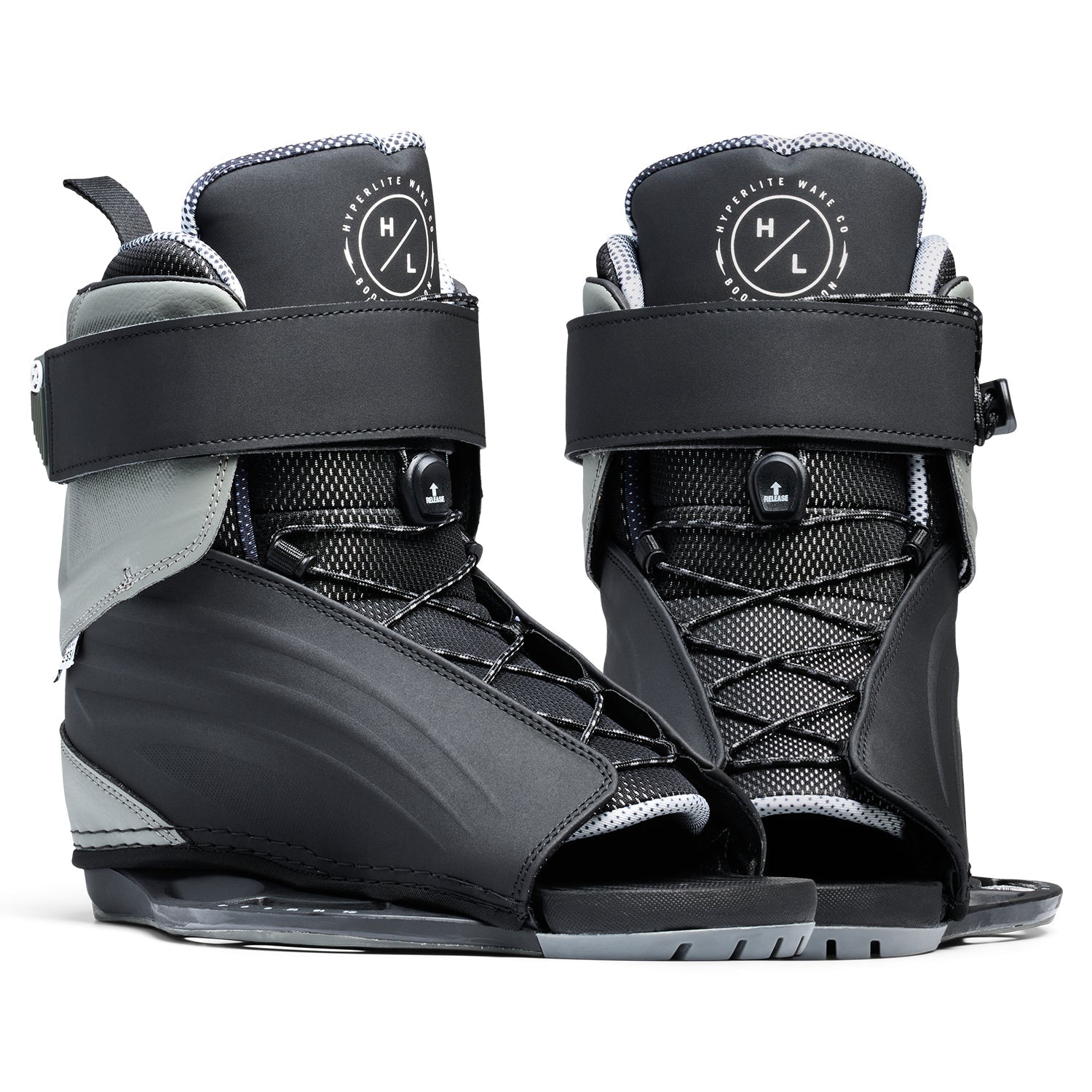 Angled view of Session Binding pair showing black and gray open-toe boots with straps and laces.