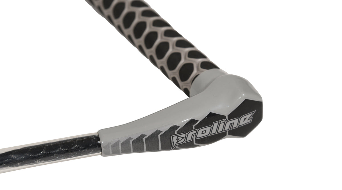 Close-up of grey handle end with Proline logo and black-and-grey patterned grip texture.