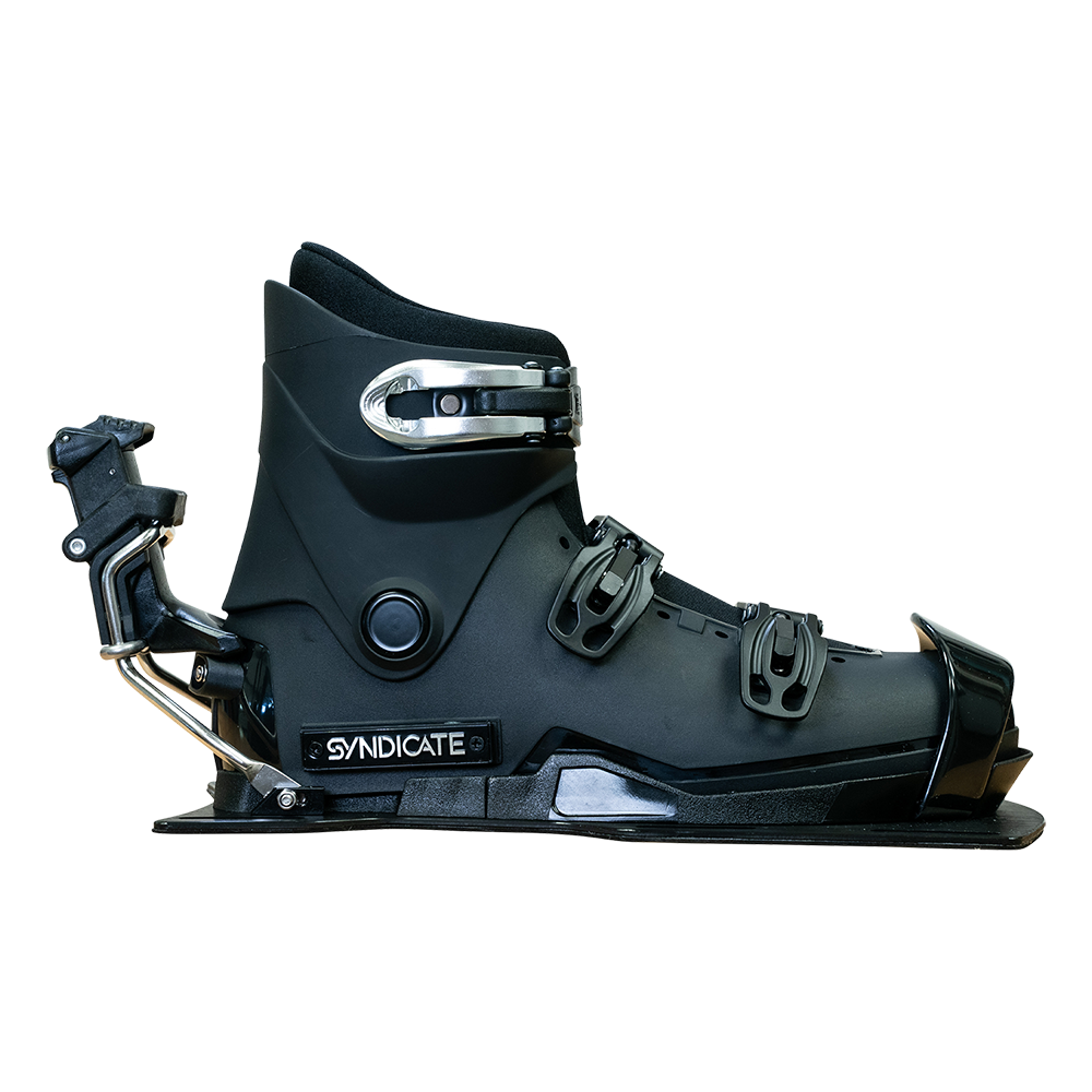 Left-side view of the Syndicate Hardshell boot, black with adjustable buckles, reinforced shell, and rear release mechanism.