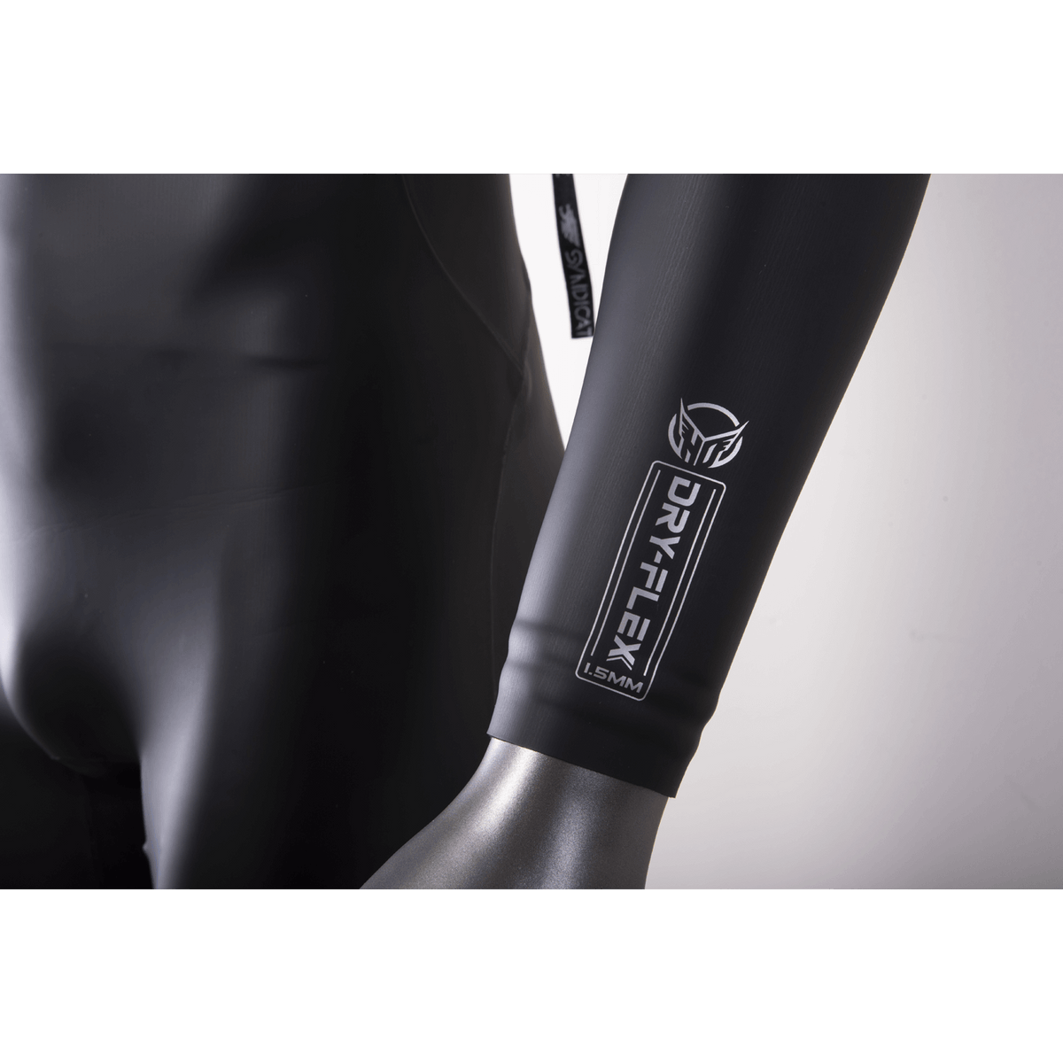 Close-up of the wetsuit sleeve, showing the Dry-Flex 1.5MM material with a sleek black finish and white logo.